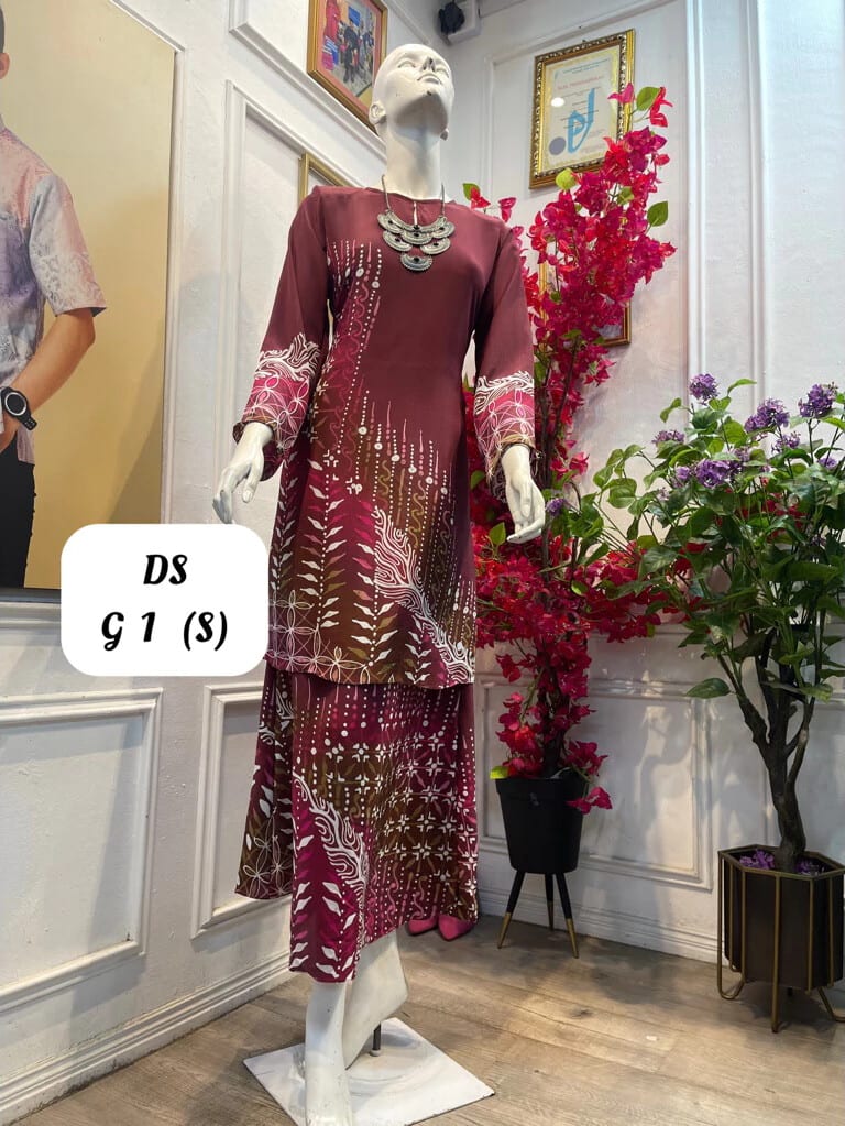 Women's silk crepe batik baju kurung moden DS G 1 in maroon, pink and white, on a mannequin