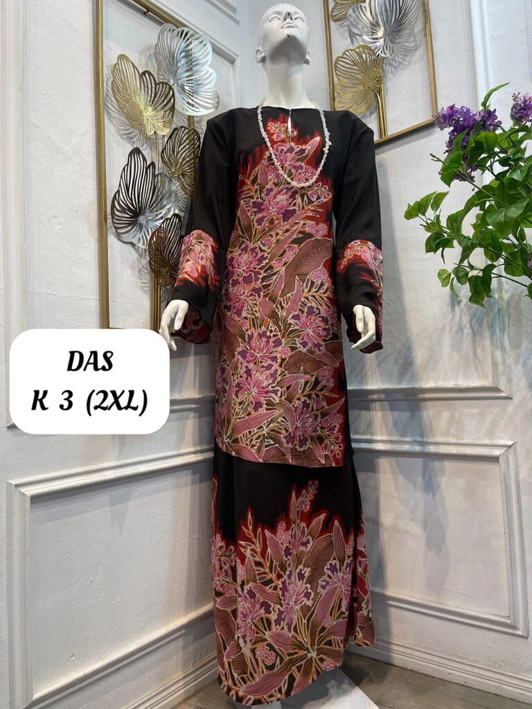Women's silk crepe batik baju kurung moden DAS K 3 in black, pink and red, on a mannequin