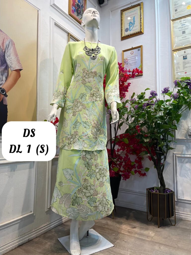 Women's silk crepe batik baju kurung moden DS DL 1 in pale green, grey and light blue, on a mannequin