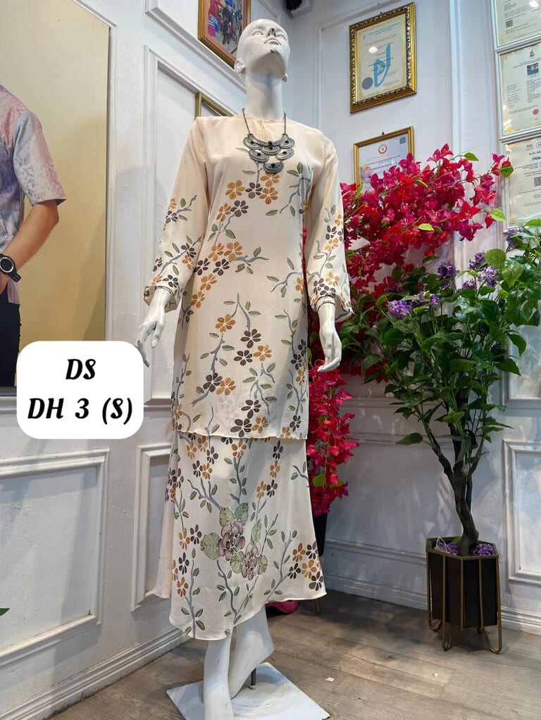 Women's silk crepe batik baju kurung moden DS DH 3 in cream, orange, brown and grey-green, on a mannequin
