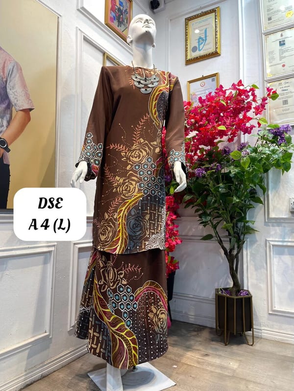 Women's silk crepe batik baju kurung moden DSE A 4 in brown, gold and blue, on a mannequin