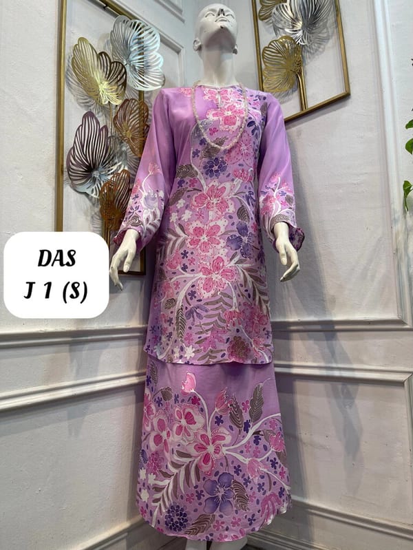 Women's silk crepe batik baju kurung moden DAS J 1 in lilac, pink and purple, on a mannequin