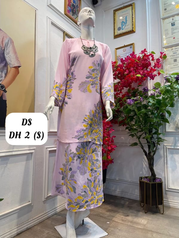 Women's silk crepe batik baju kurung moden DS DH 2 in light pink, lilac, yellow and grey, on a mannequin