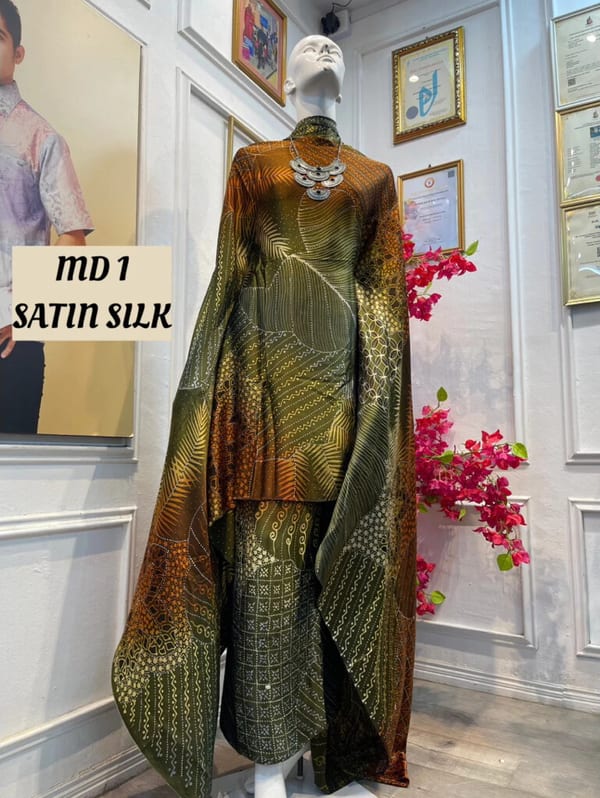 Satin silk batik fabric MD 1 in olive green and orange, draped on a mannequin