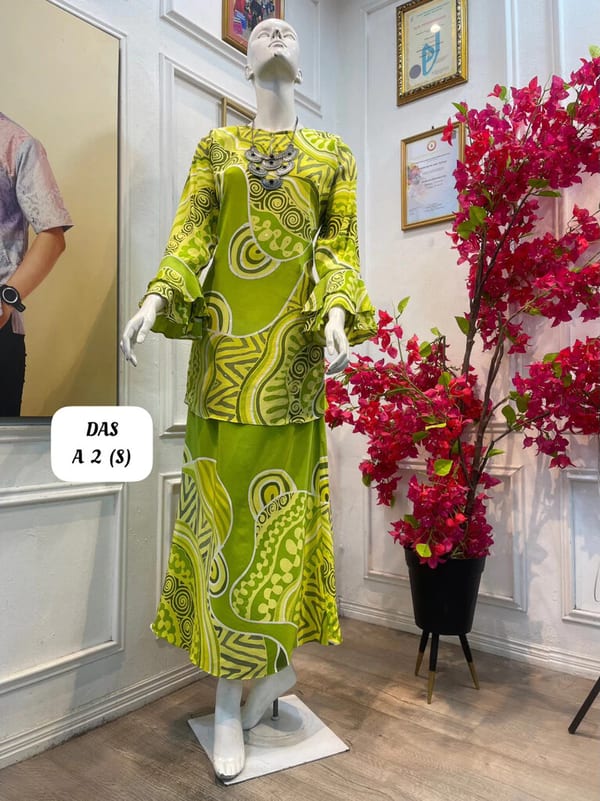 Women's silk crepe batik baju kurung moden DAS A 2 in lime green and olive green, on a mannequin