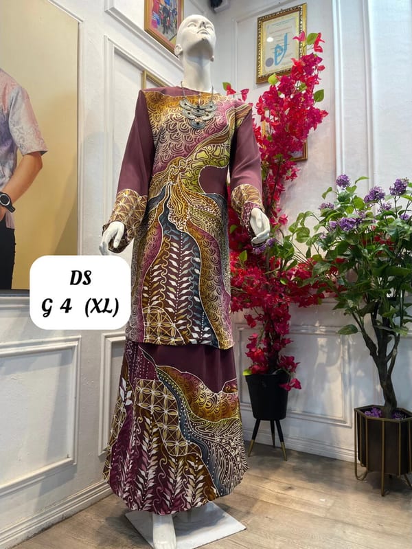 Women's silk crepe batik baju kurung moden DS G 4 in plum, gold and brown, on a mannequin