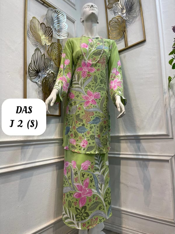 Women's silk crepe batik baju kurung moden DAS J 2 in lime green, pink and dark green, on a mannequin