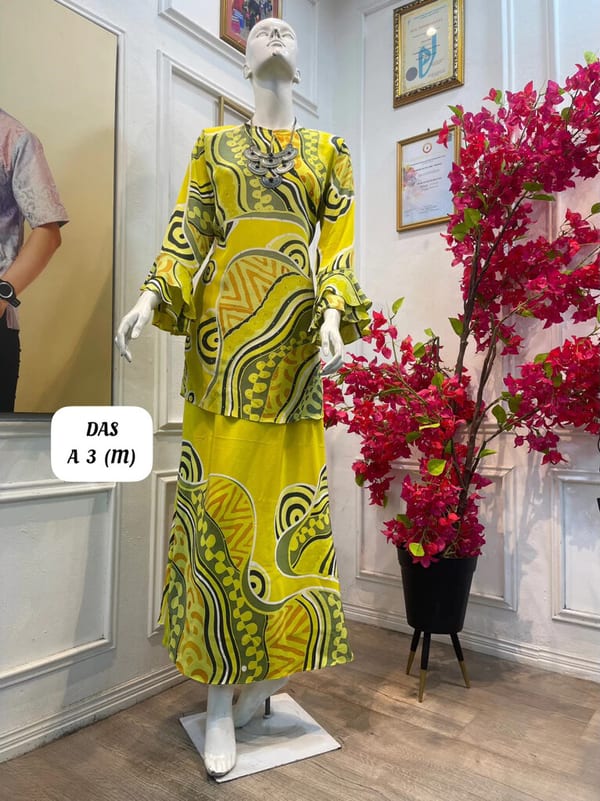 Women's silk crepe batik baju kurung moden DAS A 3 in yellow, olive green and orange, on a mannequin